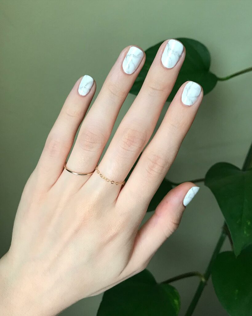 Embrace Elegance with 15 White Marble Nail Designs in 2024 24 White Marble Short Nails