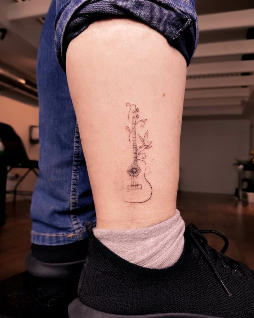 11+ Simple Guitar Tattoo Designs That Will Blow Your Mind! 15 Simple Small Guitar Tattoo