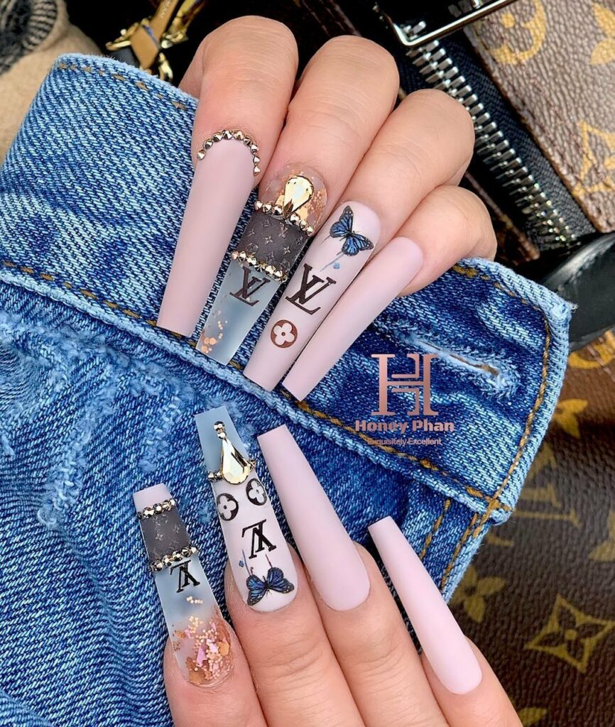 25 Latest Louis Vuitton Nails To Try In 2024 14 Louis Vuitton Ombré Nails Adorned with Butterflies