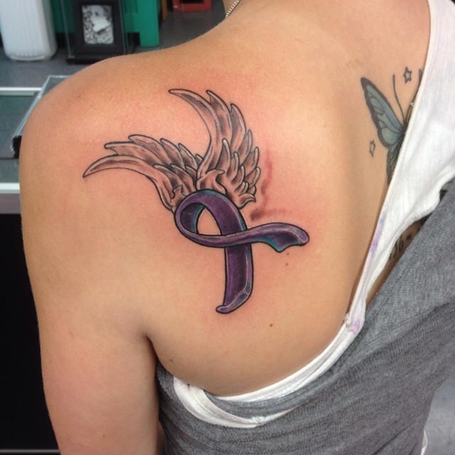 TOP 10 WING TATTOOS + MEANINGS WE'VE SEEN IN 2024 15 Breast Cancer Ribbon Wings Tattoo