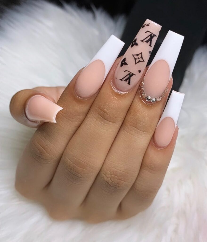 25 Latest Louis Vuitton Nails To Try In 2024 12 White French Coffin Nails with Ombré Louis Vuitton