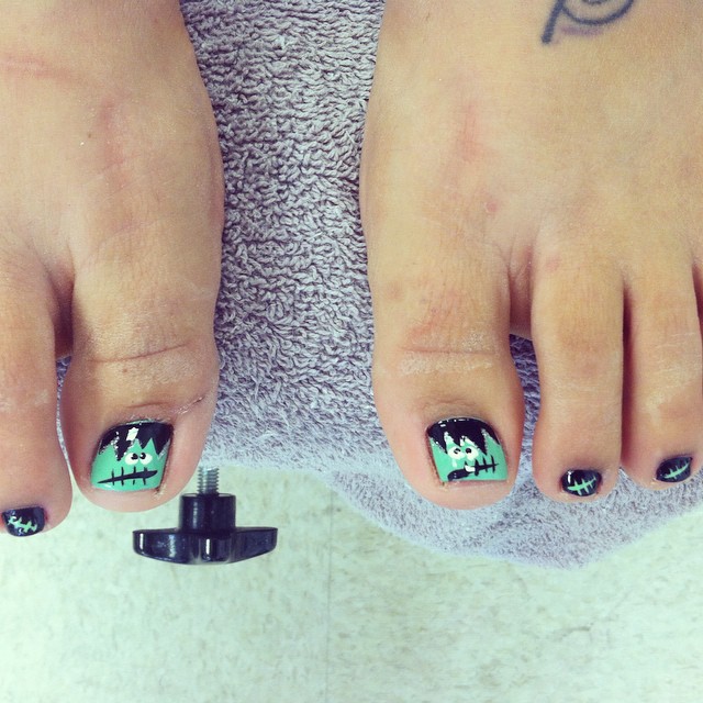 30 Spooky Halloween Pedicure Ideas to Try in 2024 20 Neon Green Marvel with Frankenstein Highlight
