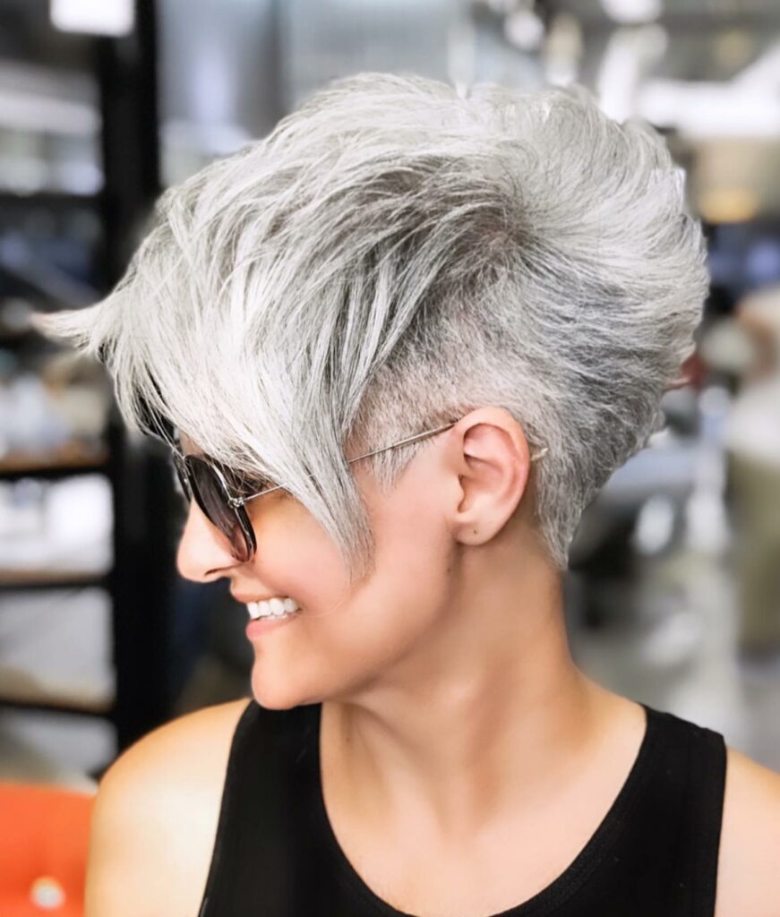 35 Short-Sided Shaved Female Hairstyles to Flaunt Your Boldness in 2024 35 Grey Side-Swept Pixie Cut