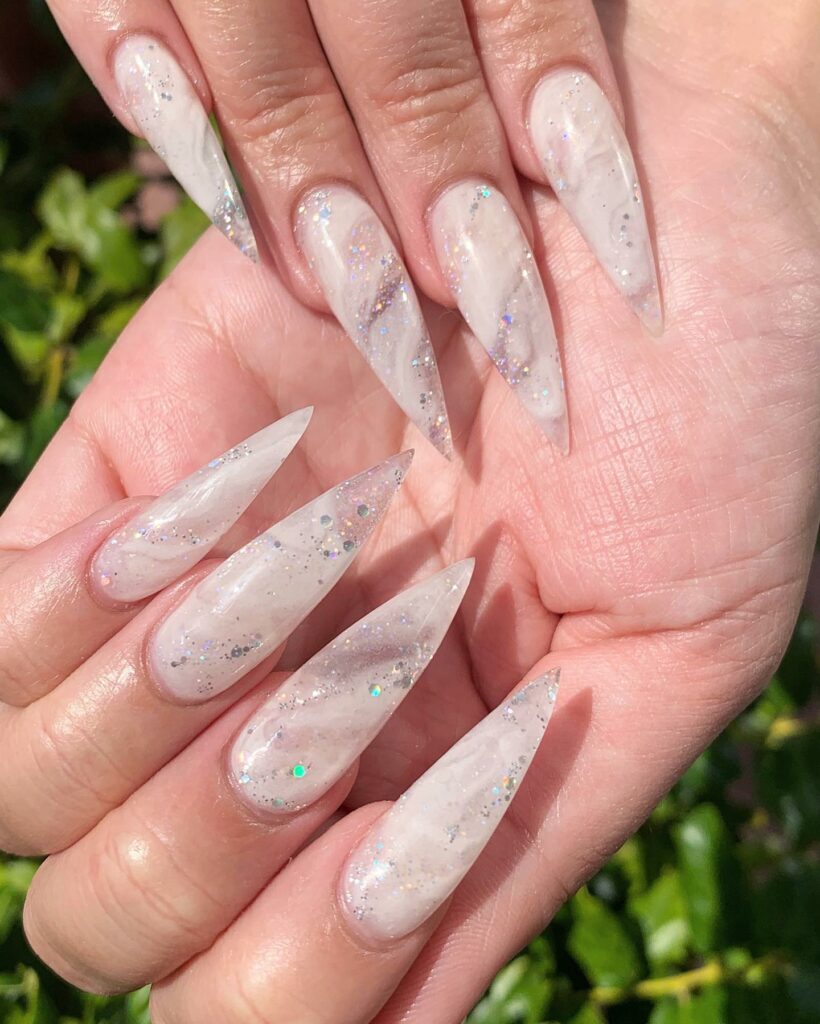 Embrace Elegance with 15 White Marble Nail Designs in 2024 20 White Marble Stiletto Nails With Colorful Glitters