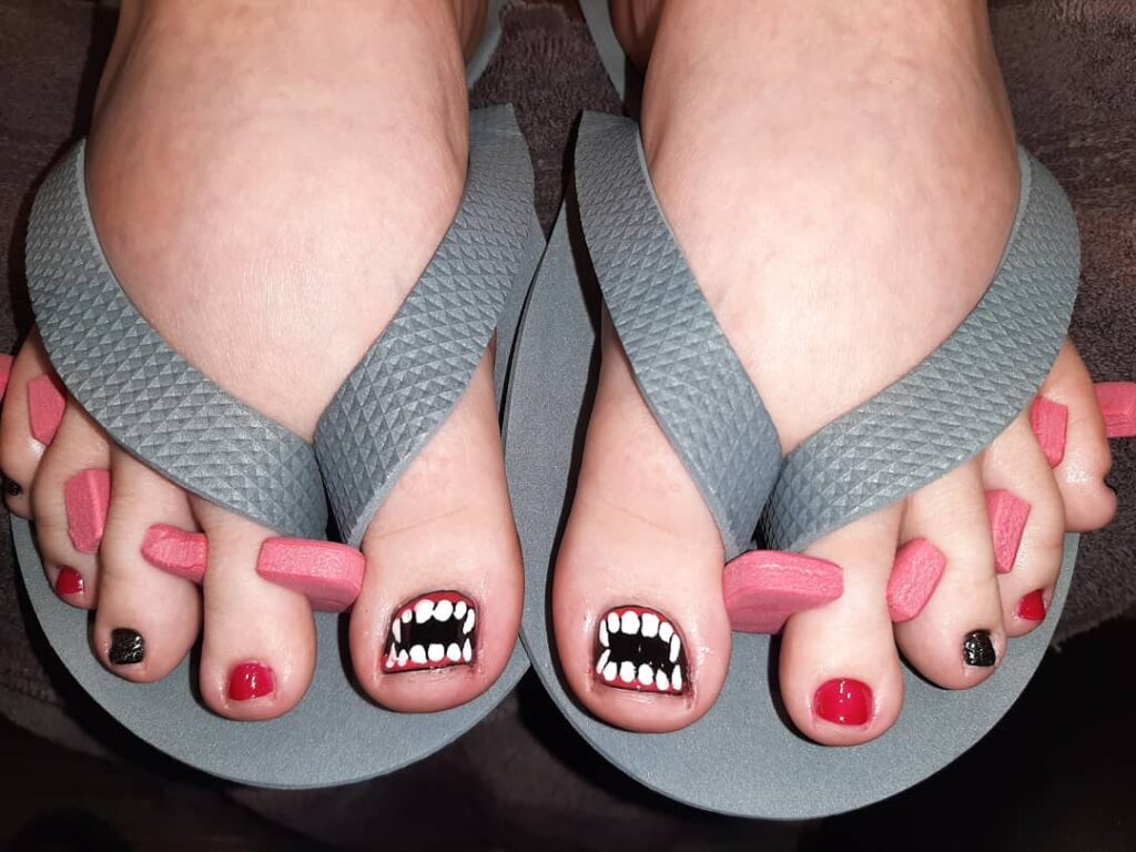 30 Spooky Halloween Pedicure Ideas to Try in 2024 26 Fang-tactic Vampire Vibes