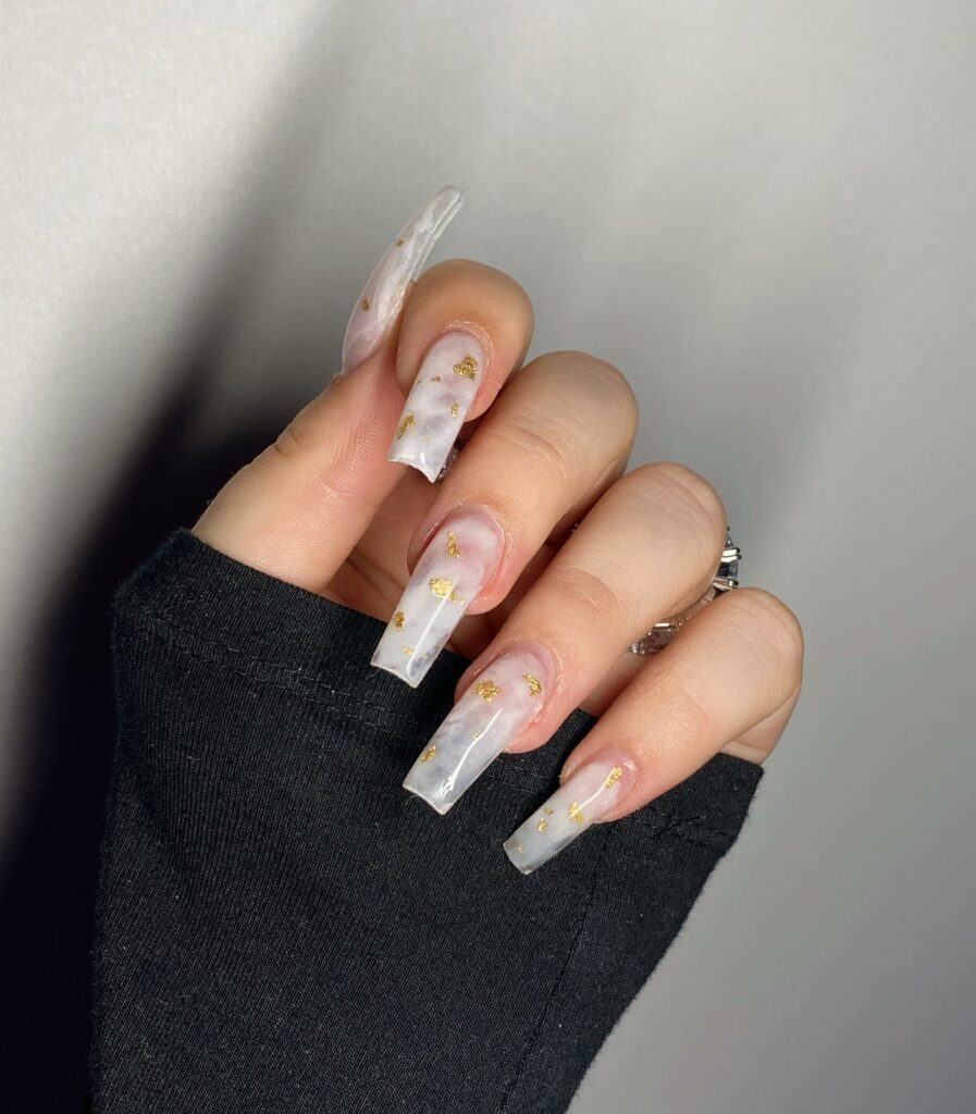 Embrace Elegance with 15 White Marble Nail Designs in 2024 10 White Marble Coffin Nails With Gold Flakes