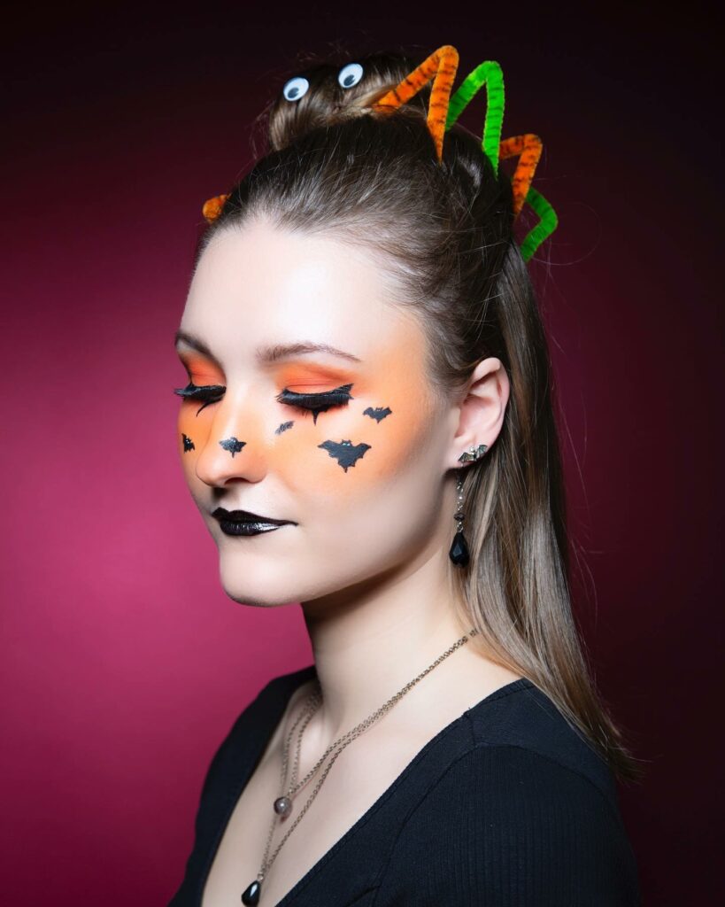 30 Spooky Halloween Hairstyles Ideas to Experiment with in 2024 25 Effortless Top Knot With a Twist