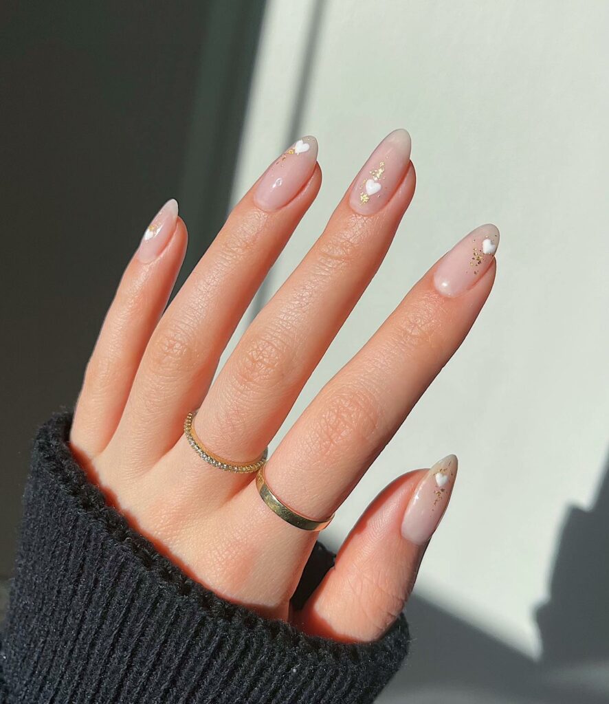 33 Latest Party Nail Ideas To Try In 2024! 25 Nude Party Nails With White Heart And Glitter Design