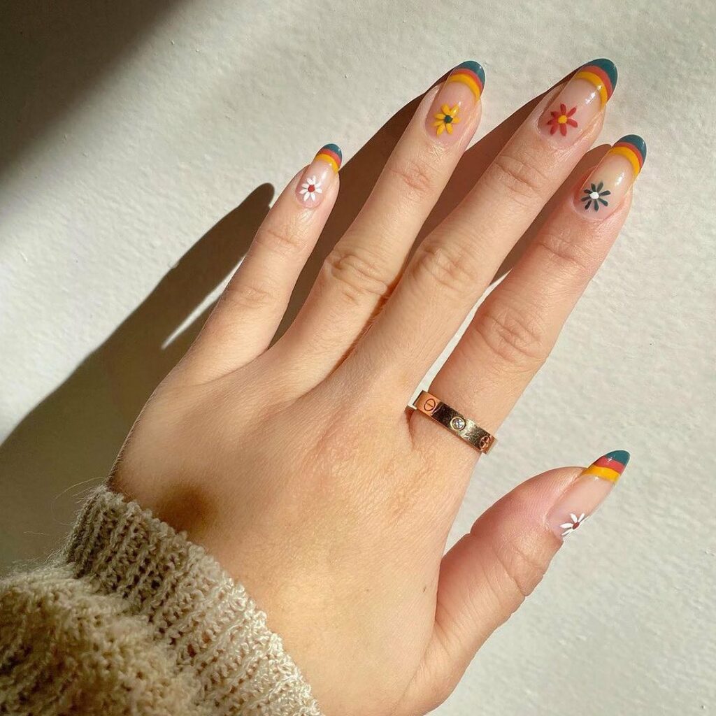 20 BEST 70S NAIL DESIGNS TO TRY IN 2024! 14 Multi Colored 70s French Nails With Flower