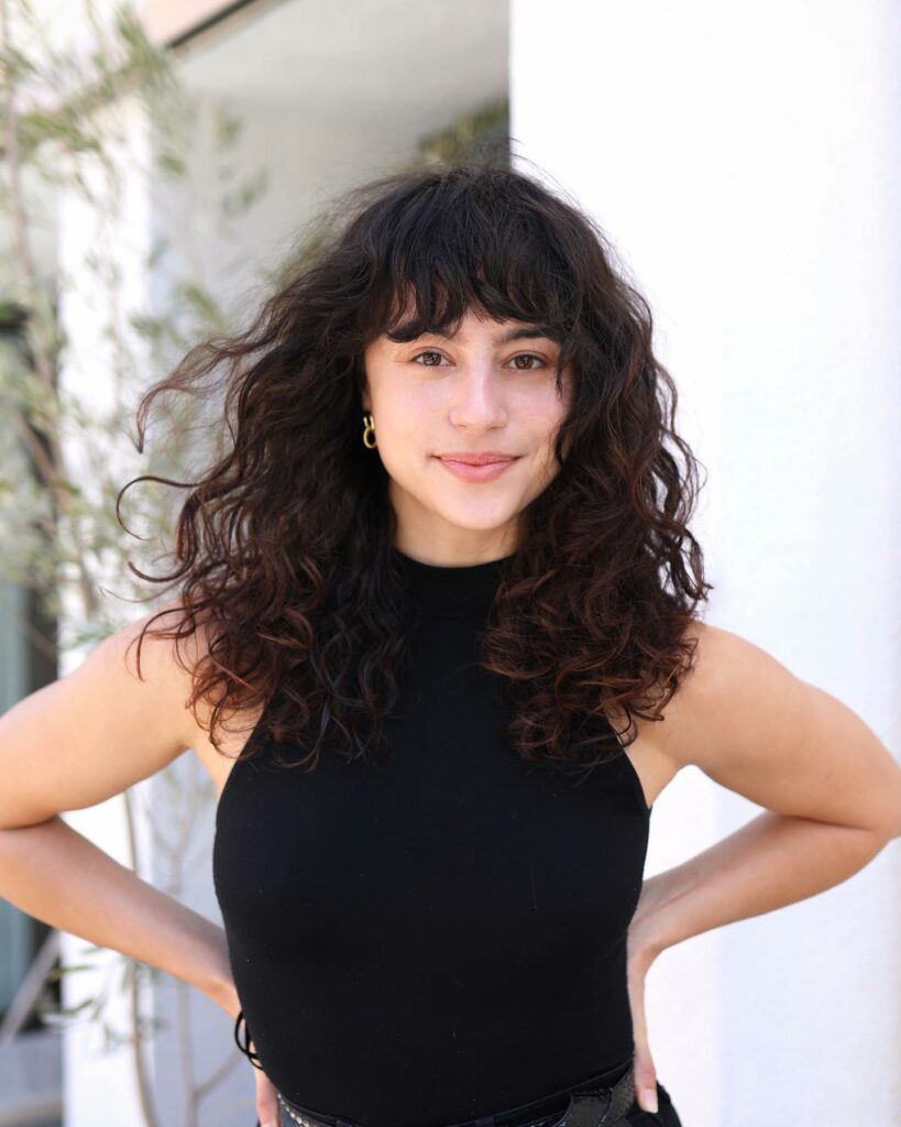 35 Long Wolf Cut Hairstyle Ideas to Try in 2024 30 Curly Wolf Hair with Bangs