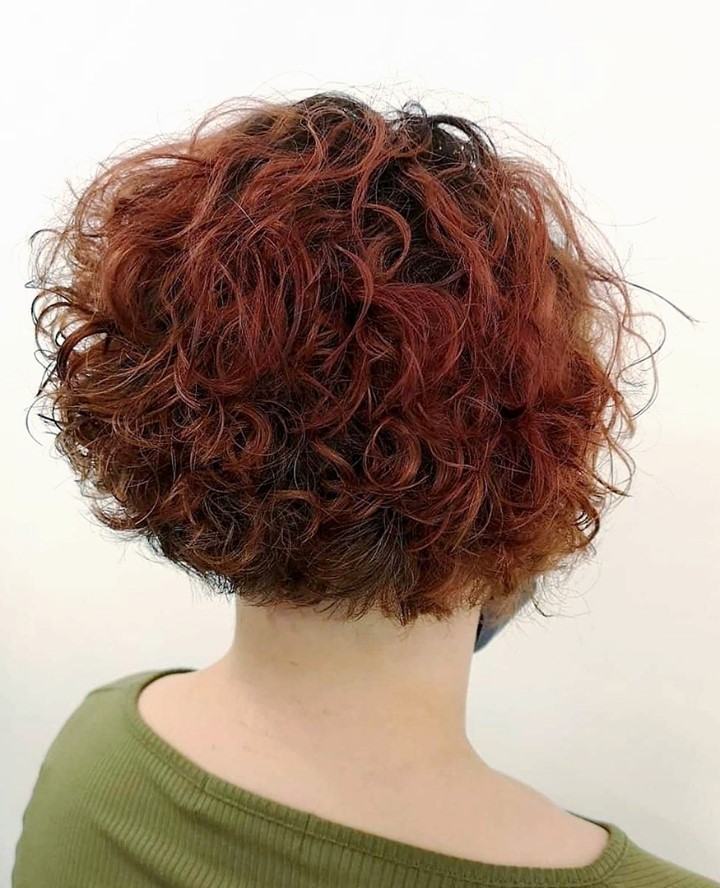 25 Curly Hair Perm Ideas to Transform Your Look in 2024 17 Short Red Stacked Perm Bob