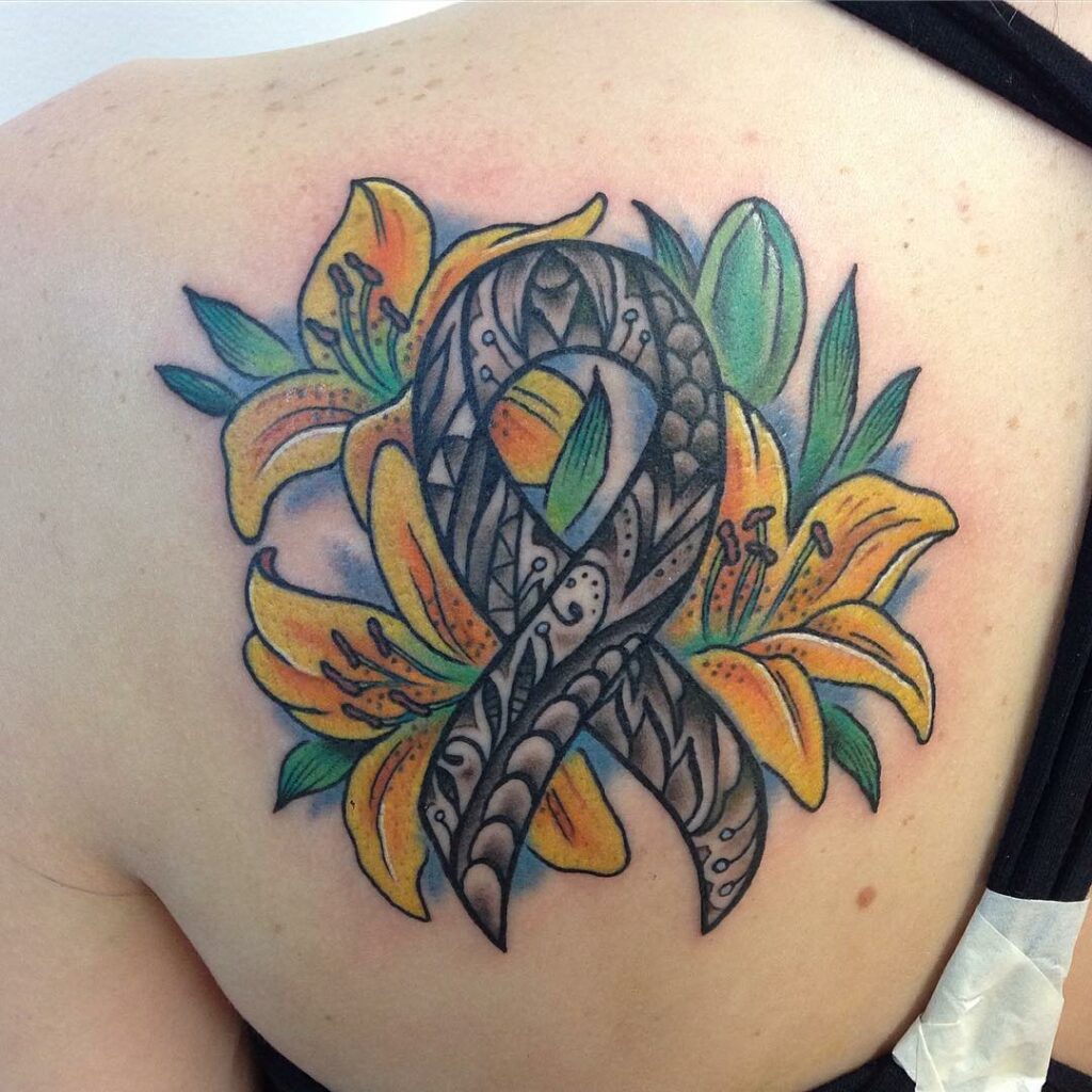 AMAZING LILY TATTOO DESIGNS + A DEEP DIVE INTO THEIR MEANINGS IN 2024 13 Yellow Lily Tattoo