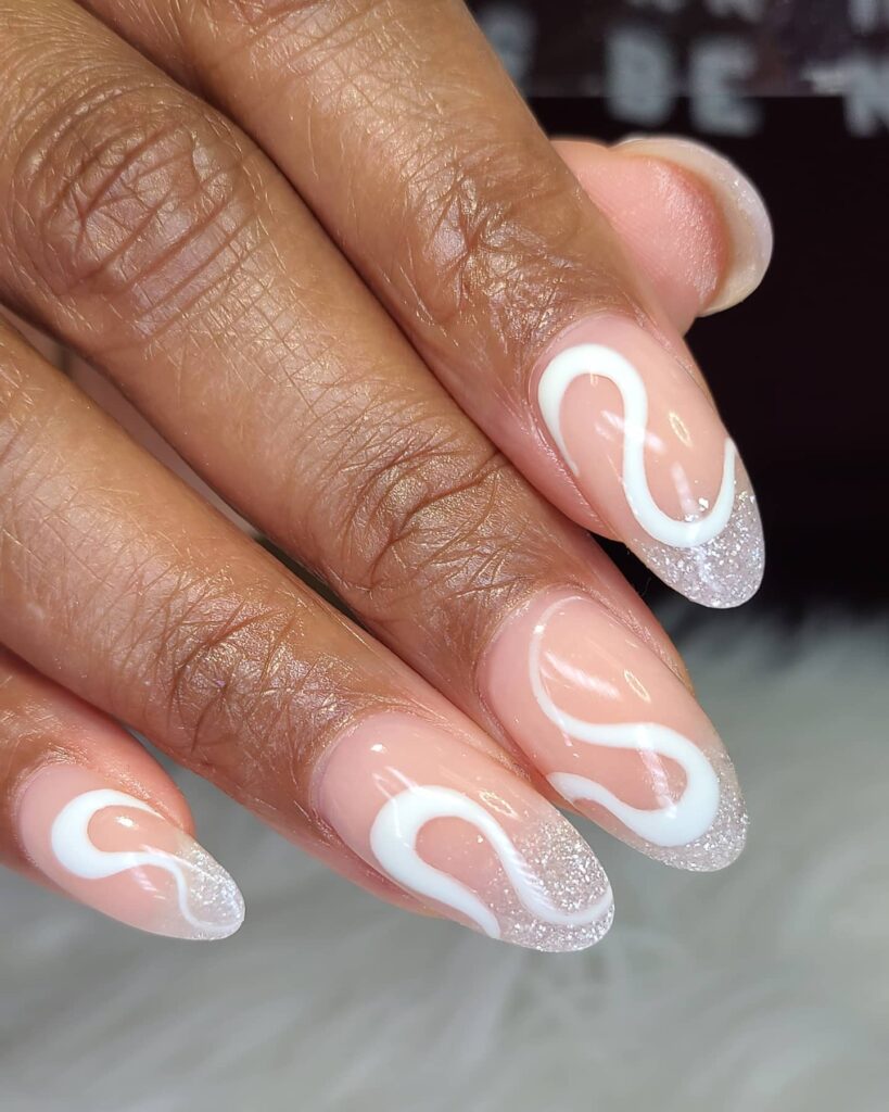 Get Swirly with 35 Swirl Nails Ideas for 2024 13 White Swirl Nails with Silver Glitter Accents
