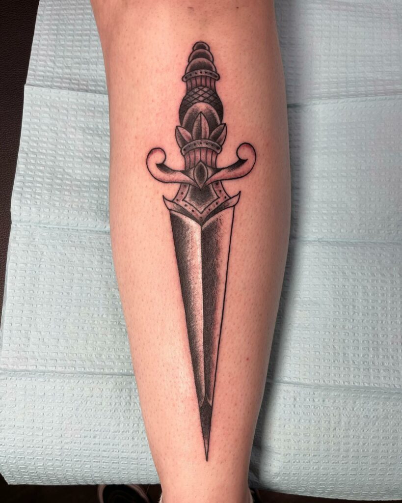 12+ Traditional Dagger Tattoo Ideas - To Inspire You In 2024 17 Black and Gray Dagger Tattoo