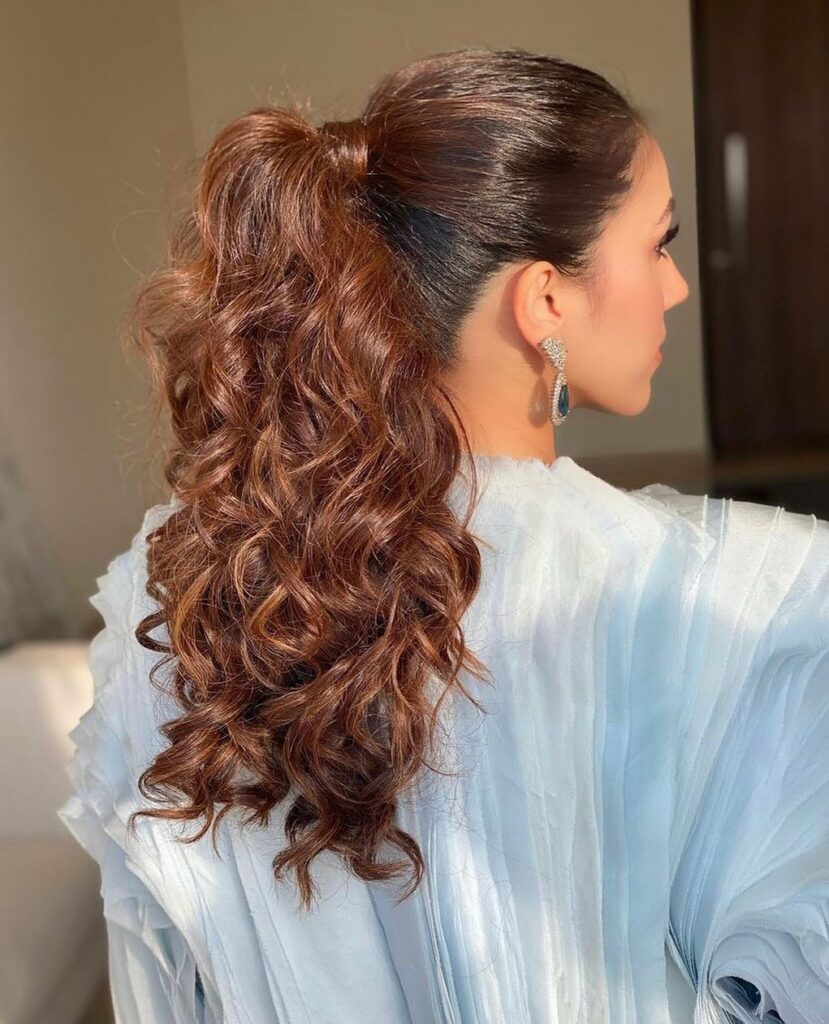 35 Ponytail Hairstyles Ideas for Effortless Elegance in 2024 12 Glam Up With A Curly Ponytail