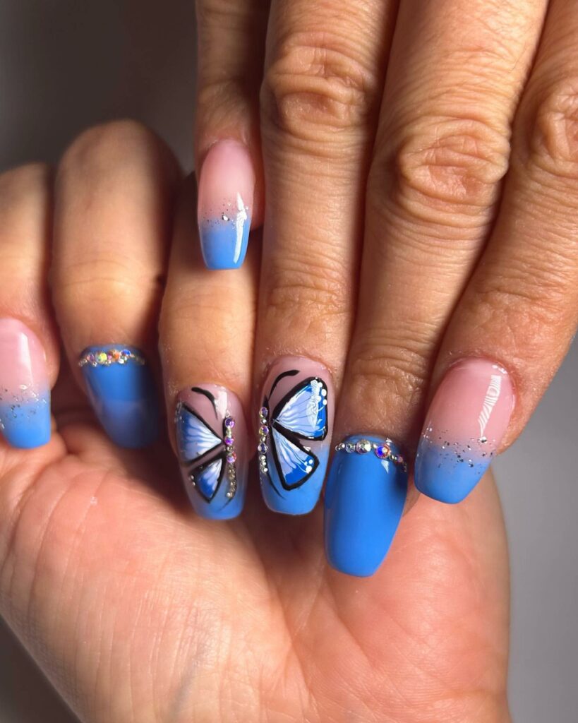 50 Latest Butterfly Nail Designs To try In 2024! 48 Serene Ombre Light Blue Butterfly Nails