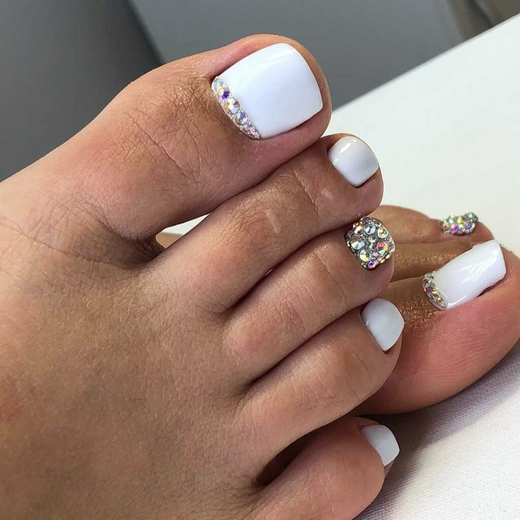 30 Wedding Pedicure Ideas to Match Your Bridal Look in 2024 23 Classic White Pedi Enhanced with Gems