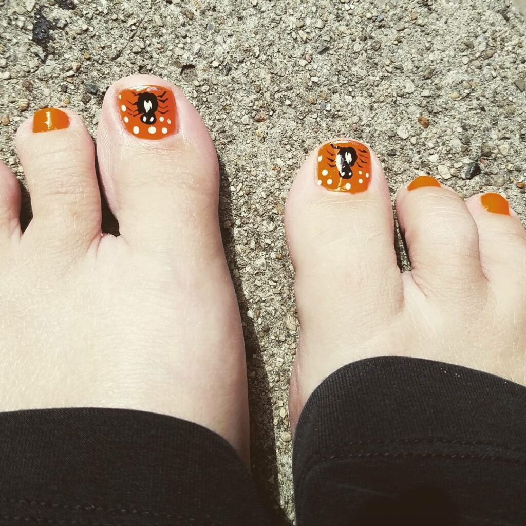 30 Spooky Halloween Pedicure Ideas to Try in 2024 22 Cute yet Halloween-Ready Polka Dots