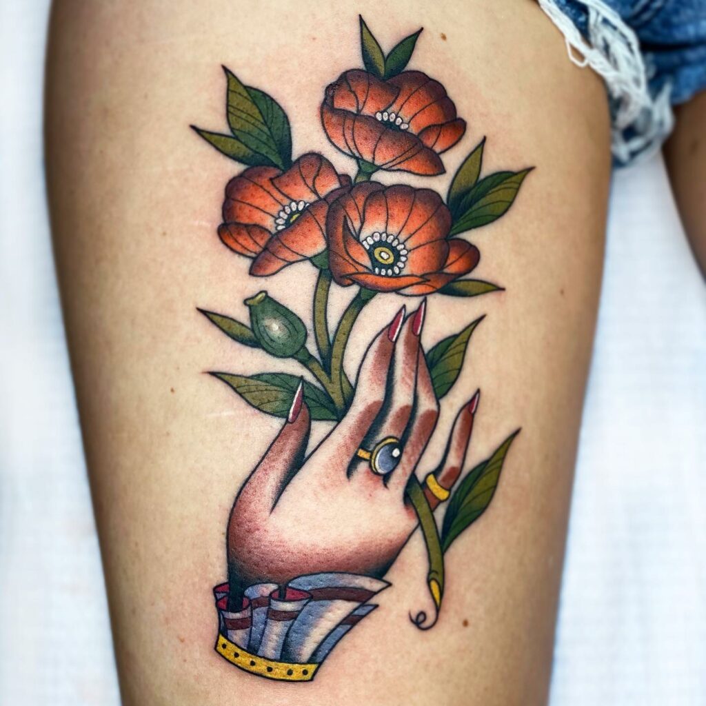 POPPY FLOWER TATTOOS: AN ACCURATE GUIDE TO THEIR MEANINGS 15 Hand Holding A Poppy Tattoo