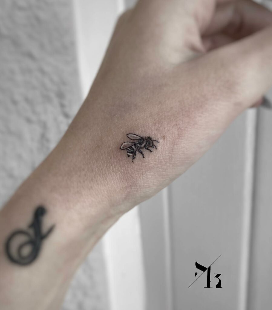 10 AMAZING BEE TATTOO IDEAS + MEANINGS - NEW FOR 2024 21 Wrist Bee Tattoo