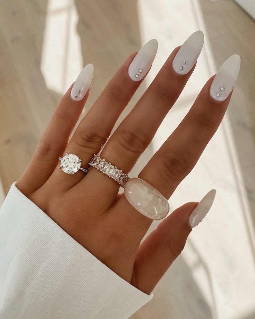 Attend in Style with 25 Wedding Guest Nail Designs in 2024 26 White Almond With Rhinestones Wedding Guest Nails