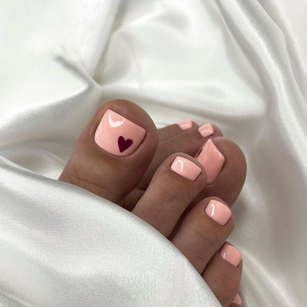 Get Playful with 30 Heart Toenail Pedicure Ideas for 2024 18 Maroon Heart Nail Art On Pastel Color Pedicure