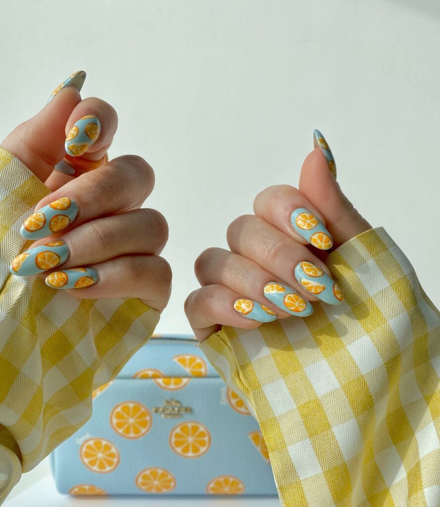 20 Latest Orange And Blue Nail Ideas To Try In 2024! 24 Blue Nails With Orange Fruit Design