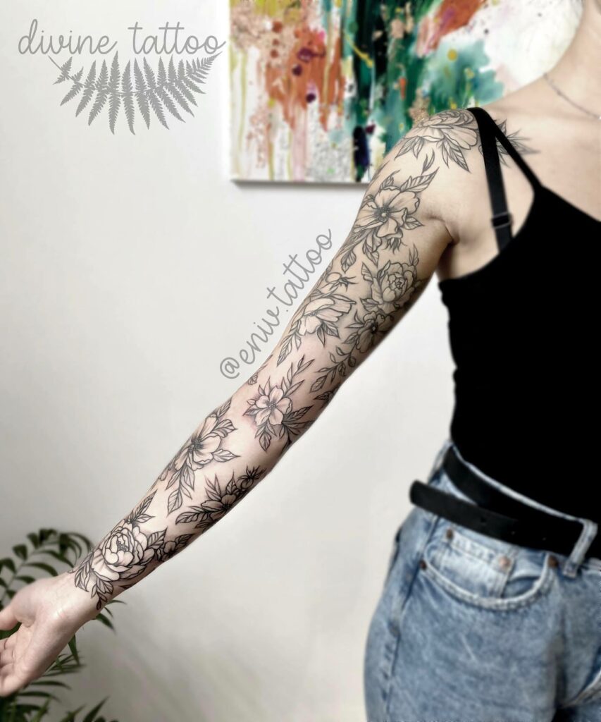 10+ Arm Flower Tattoo Ideas You’ll Have To See To Believe! 14 Beautiful Sleeve Type Arm Flower Tattoo In Black