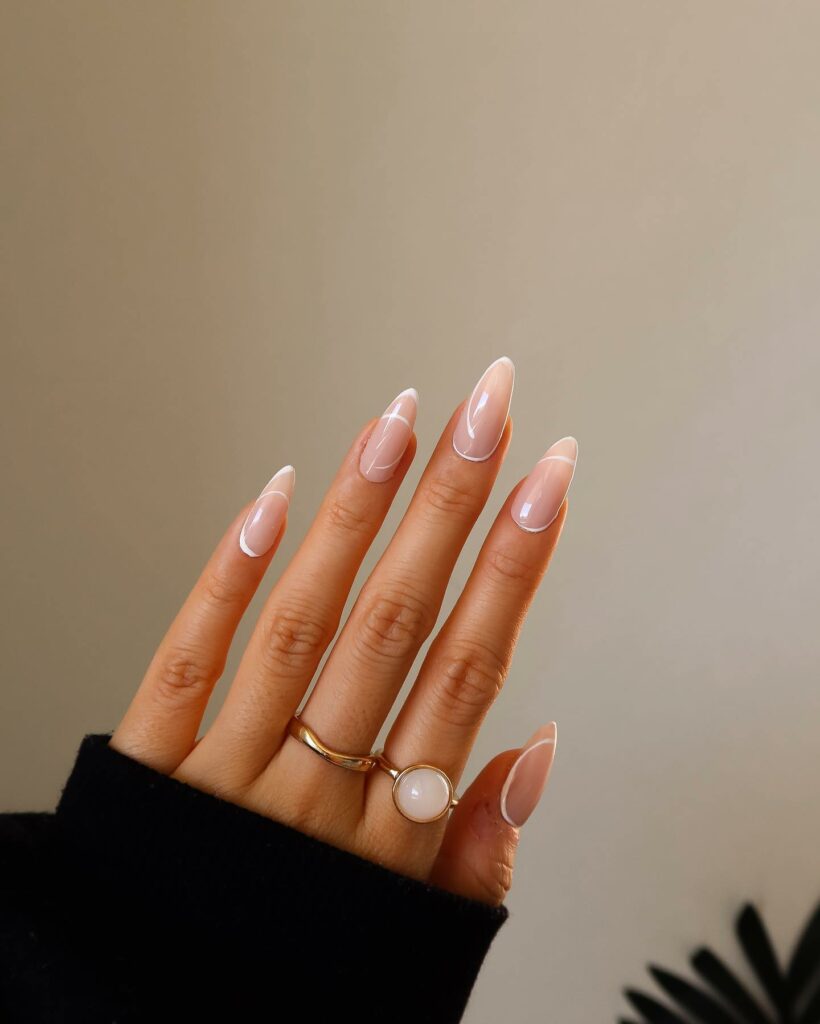 20 Latest Thin French Tip Nail Designs To Try In 2024! 29 Almond Thin French Tip Nails With Swirl