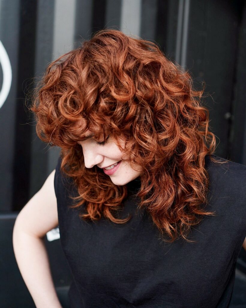 35 Reddish Brown Hair Color Ideas to Try in 2024 28 Dark Copper Brown Curls