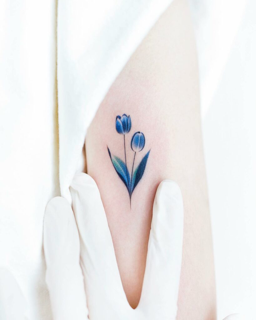 AMAZING TULIP TATTOO DESIGNS + MEANINGS TO INSIRE YOU IN 2024 16 Blue Tulip Tattoo