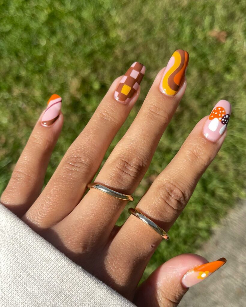 20 Latest Mushroom Nail Designs To Try In 2024! 14 Brown Mushroom Nails With Checkered And Swirl Design