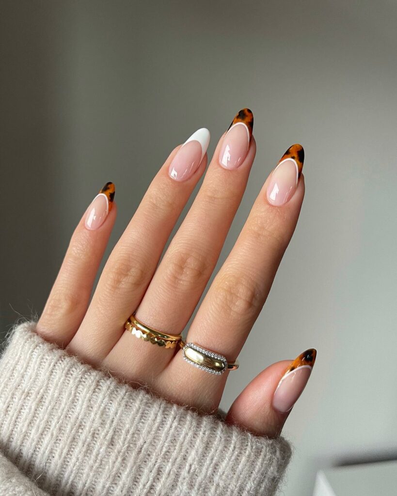 25 Latest Accent Nail Designs To Try In 2024! 25 Tortoise French Tip With White French Tip Accent Nails Design