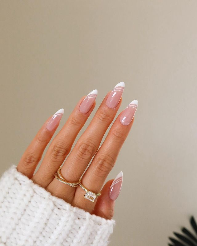 Attend in Style with 25 Wedding Guest Nail Designs in 2024 17 White Almond Wedding Guest Nails with Thin Lines