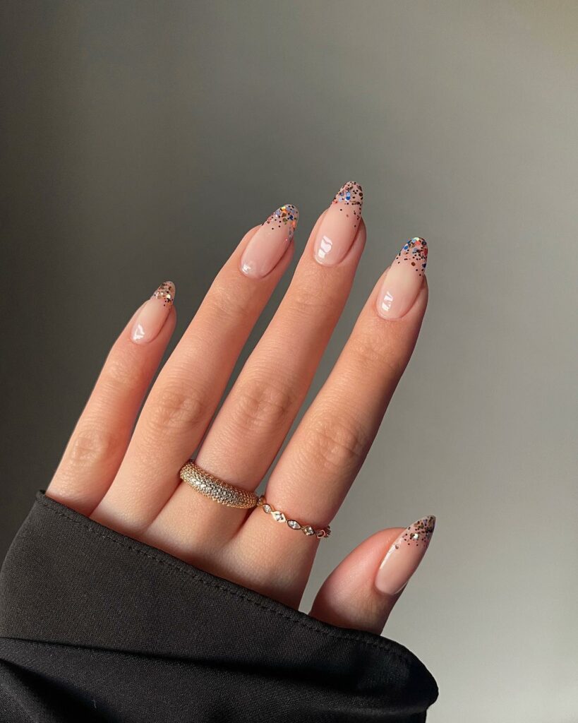 33 Latest Party Nail Ideas To Try In 2024! 11 Almond Nude Party Nails With Colorful Glitter On Tips