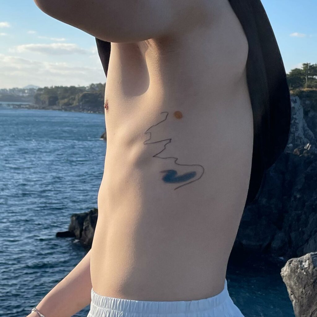 TOP 10 RIB TATTOOS DESIGNS FOR 2024 11 Side Rib Tattoo