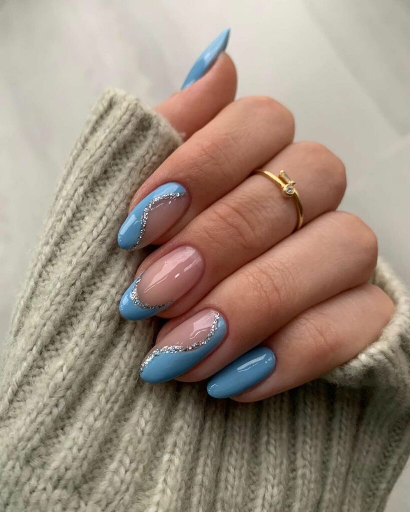 20 Latest Blue Almond Nails Ideas To Try In 2024! 16 Abstract Blue Almond Nails With Glitter
