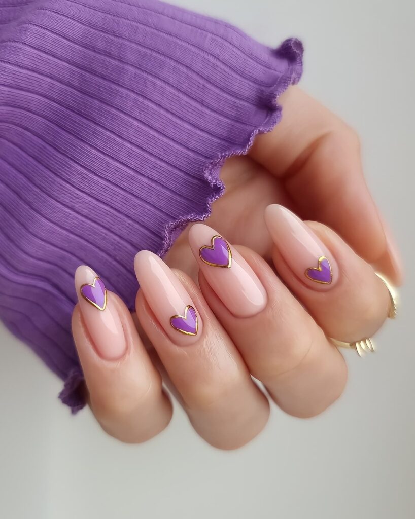20 Latest Purple And Gold Nail Ideas To Try In 2024! 13 Gold Line On Purple Heart Nails Design