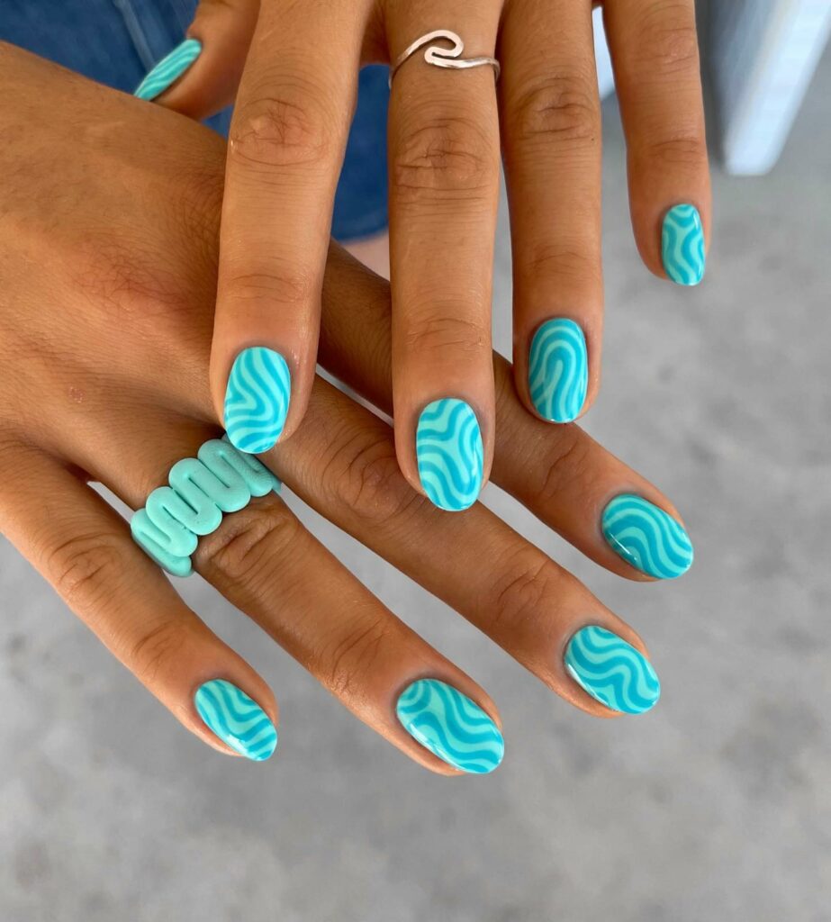 40 Latest Short Summer Nail Designs To Try In 2024! 35 Light Blue Short Nails With Swirls Design
