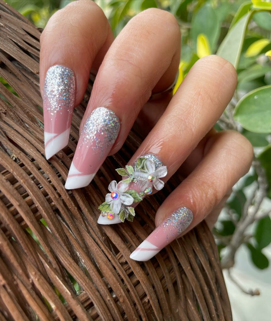 15 Latest Lipstick Shape Nail Ideas To Try In 2024! 22 Lipstick Shape Nails With Silver Glitter And Flower Design