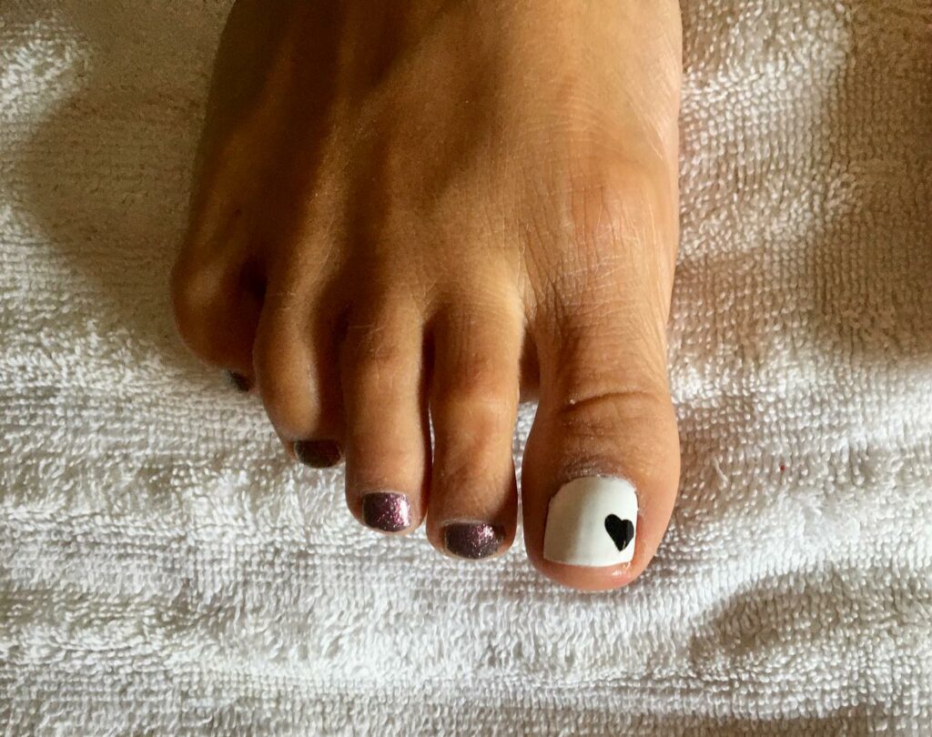 Get Playful with 30 Heart Toenail Pedicure Ideas for 2024 37 Single Black Nail Art Design