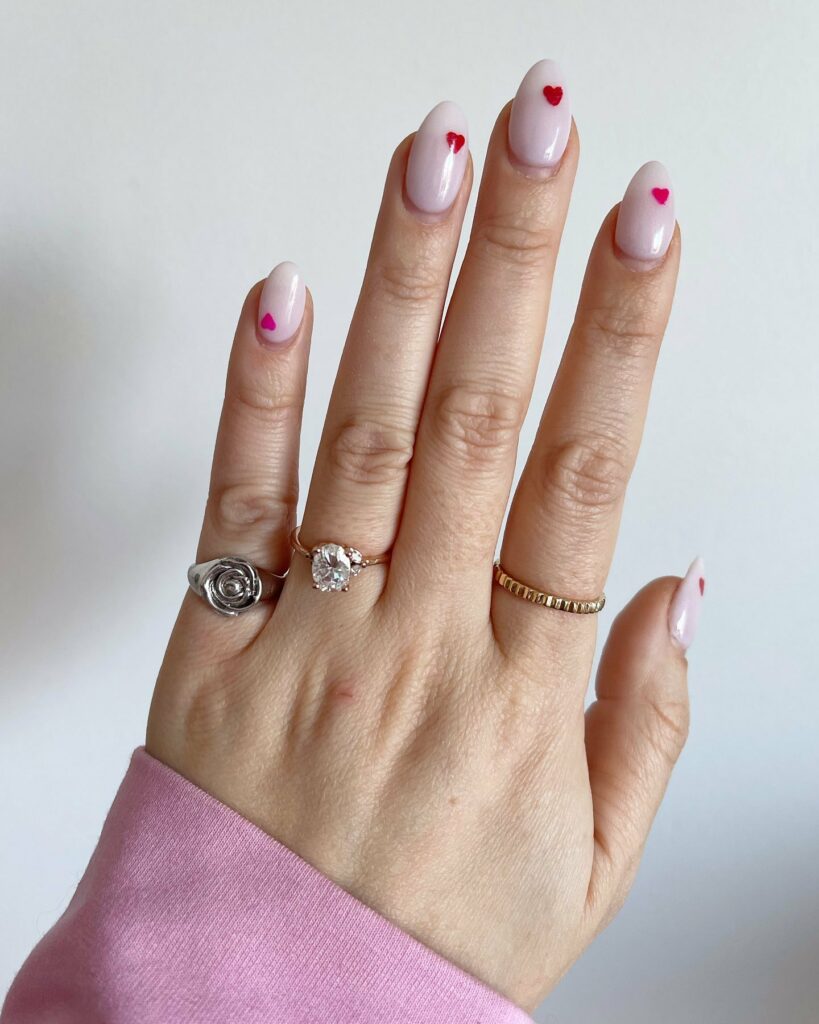 30 Latest Heart Nails Ideas To Try In 2024! 29 Tiny Red Heart Design On White Base Nails