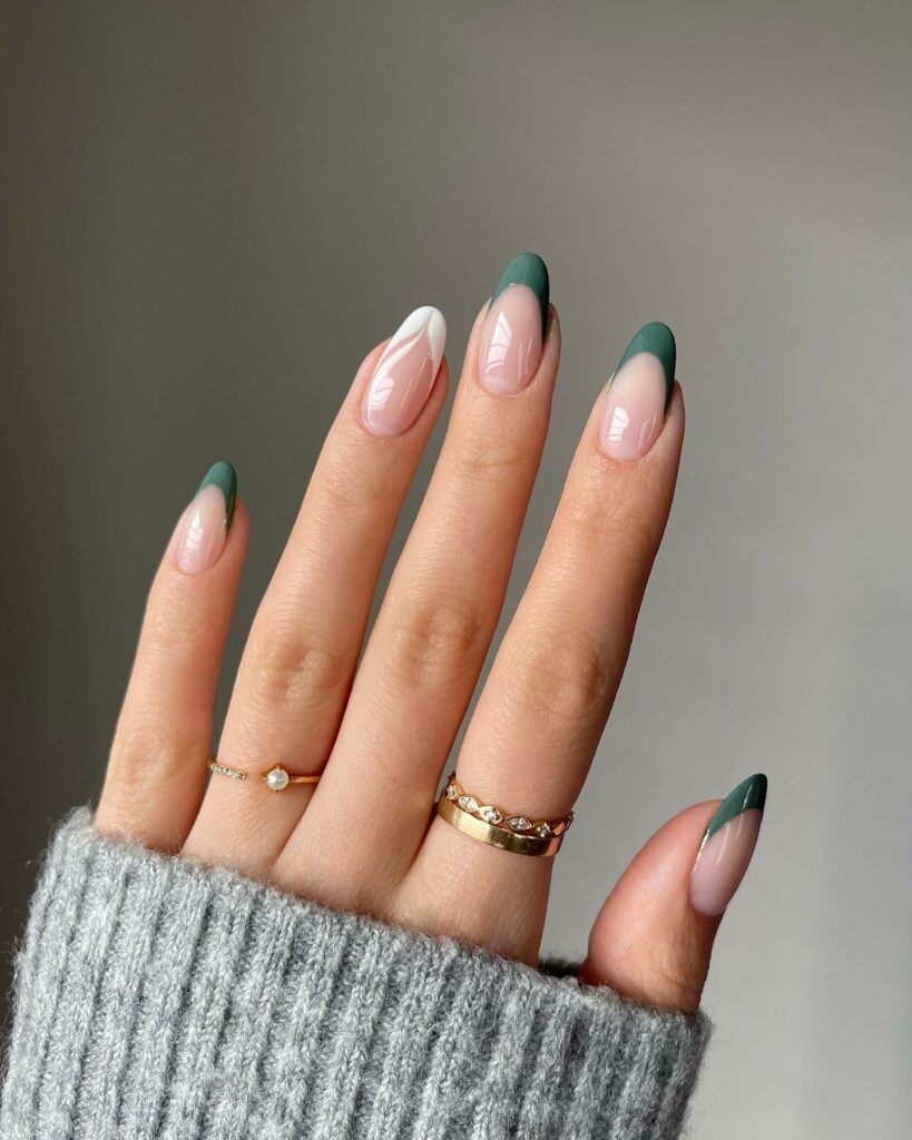 25 Latest Accent Nail Designs To Try In 2024! 22 White French Tip With Swirl Accent Nails On A Green French