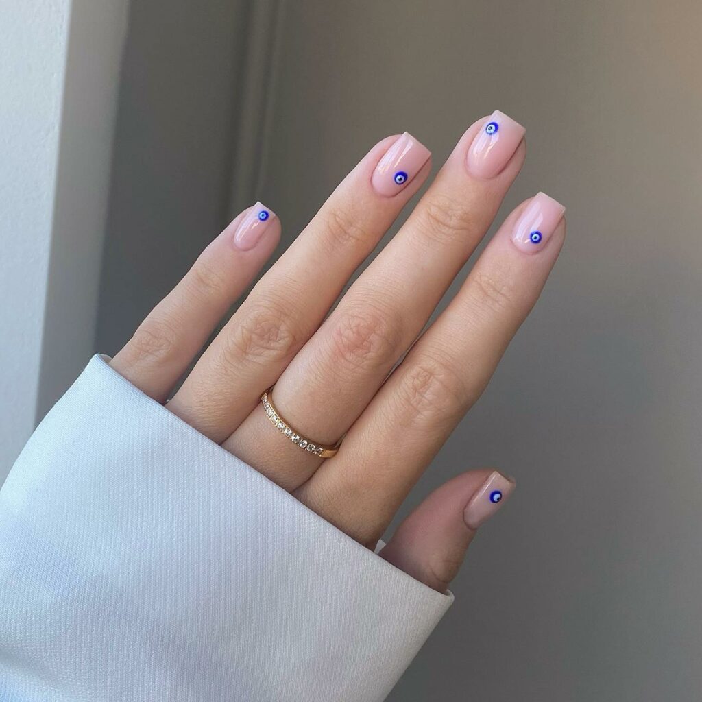 20 Latest Nude Short Nail Ideas To Try In 2024! 13 Short Nude Square Nails With Evil Eye Design