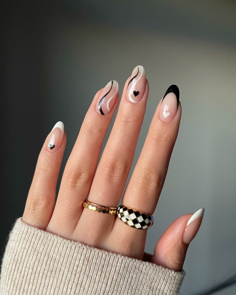 20 Latest February Nail Designs To Try In 2024! 11 Black And White February French Nails With Heart And Swirl Design
