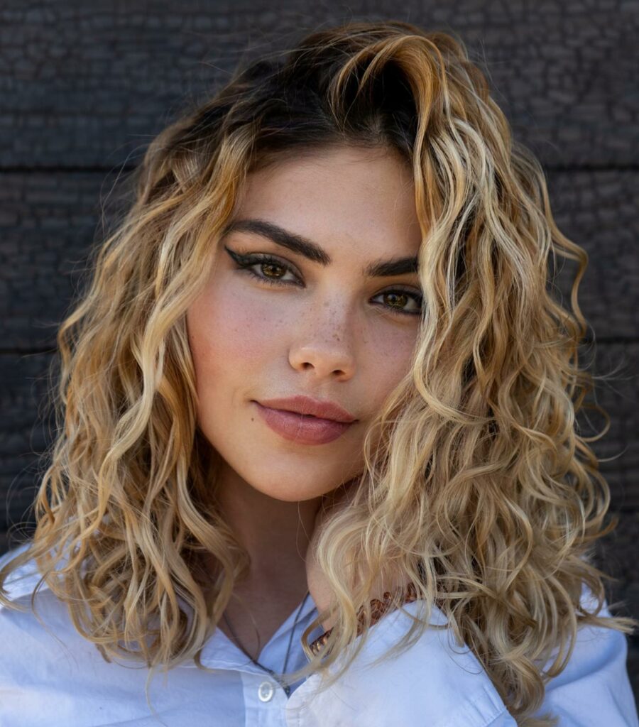 30 Medium Length Hairstyles Blonde Ideas to Try in 2024 18 Layered Curly Lob