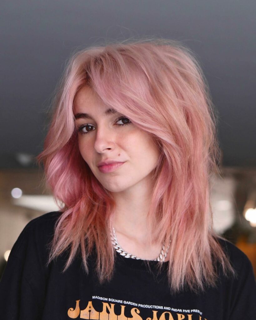 35 Long Wolf Cut Hairstyle Ideas to Try in 2024 19 Shaggy Wolf Cut with Swooping Bangs