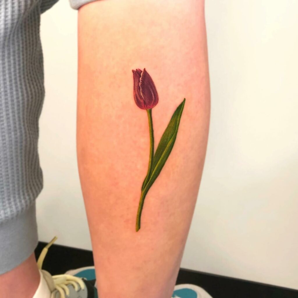 AMAZING TULIP TATTOO DESIGNS + MEANINGS TO INSIRE YOU IN 2024 11 Purple Tulip Tattoo