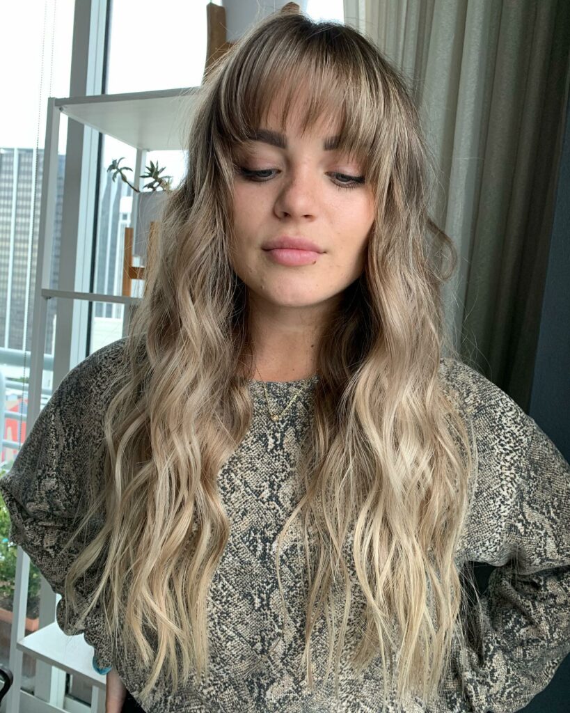 45 Wispy Long Curtain Bang Hairstyles to Try in 2024 39 See-Through Highlighted Wispy Bangs