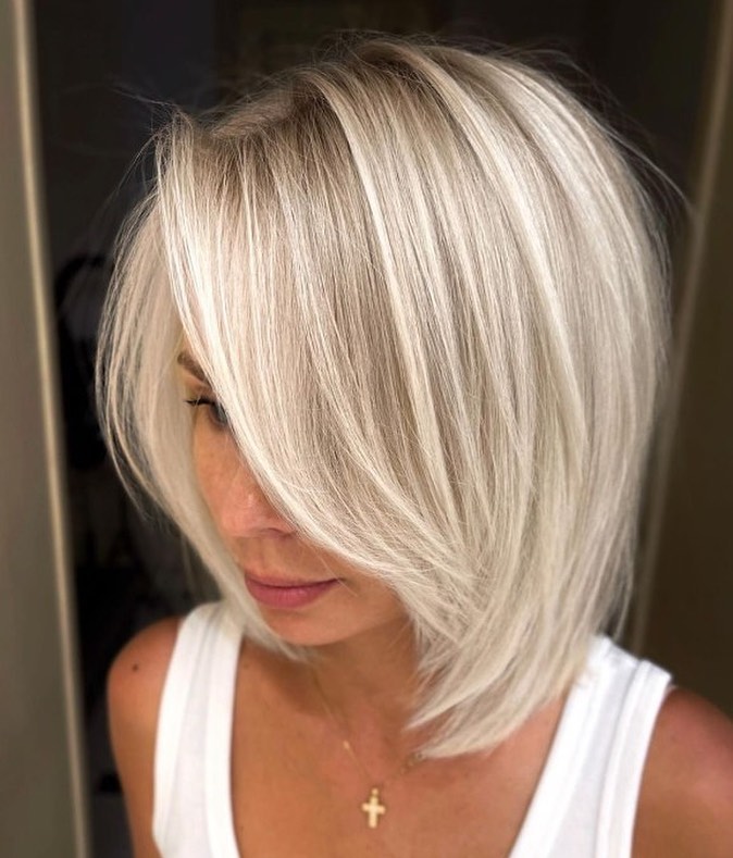 25 Short Layered Haircut Ideas to Revamp Your Look in 2024 34 Short Layered Hairstyle with Long Side Bangs
